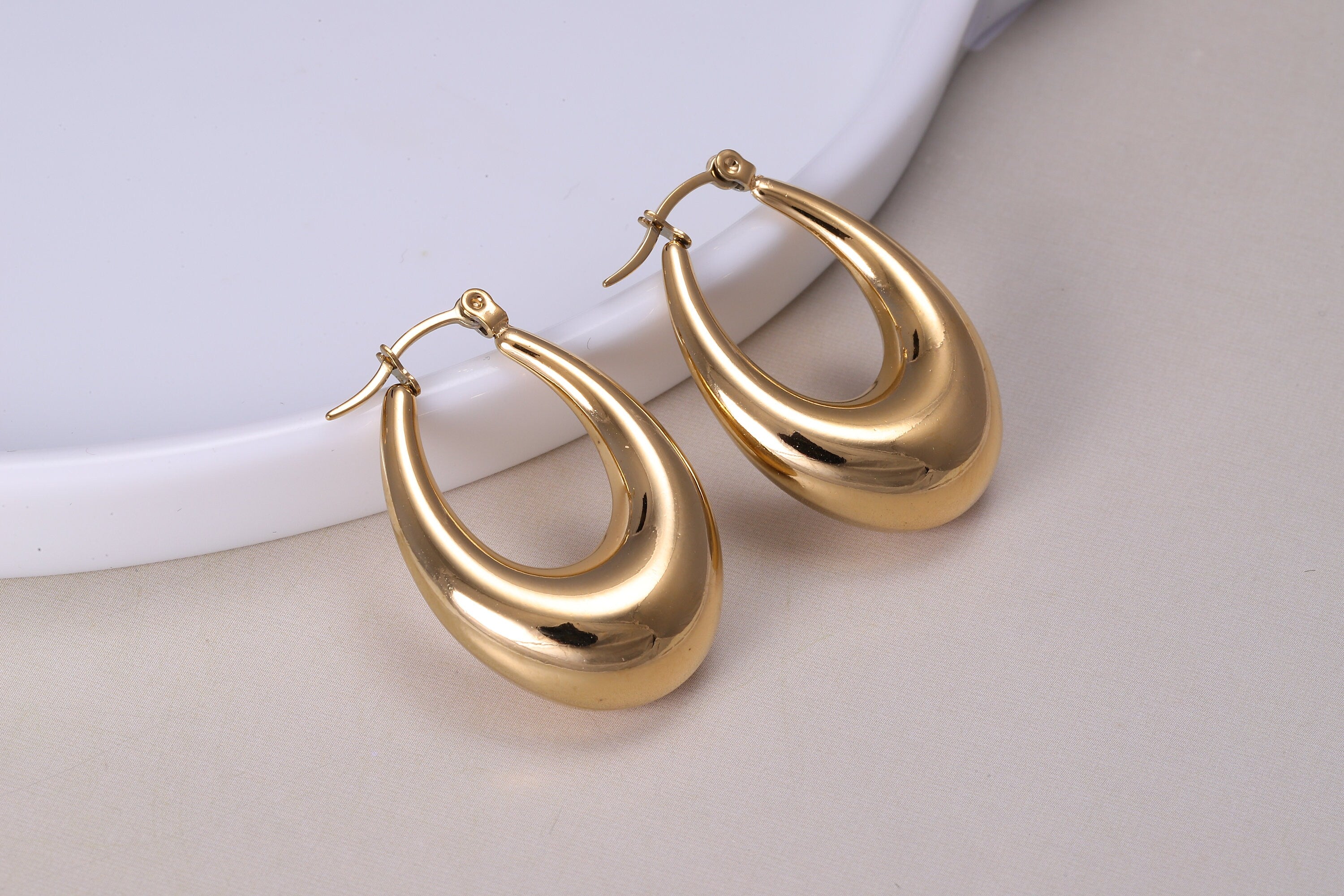 Thick oval store hoop earrings